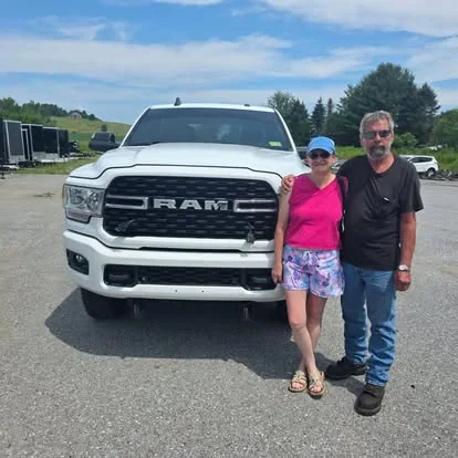 Customers picking up a new truck at Right Wheels in Derby, VT